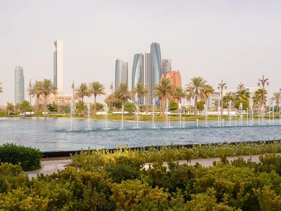 The Etihad Towers and the city skyline across the fountains of Qasr Al Watan
