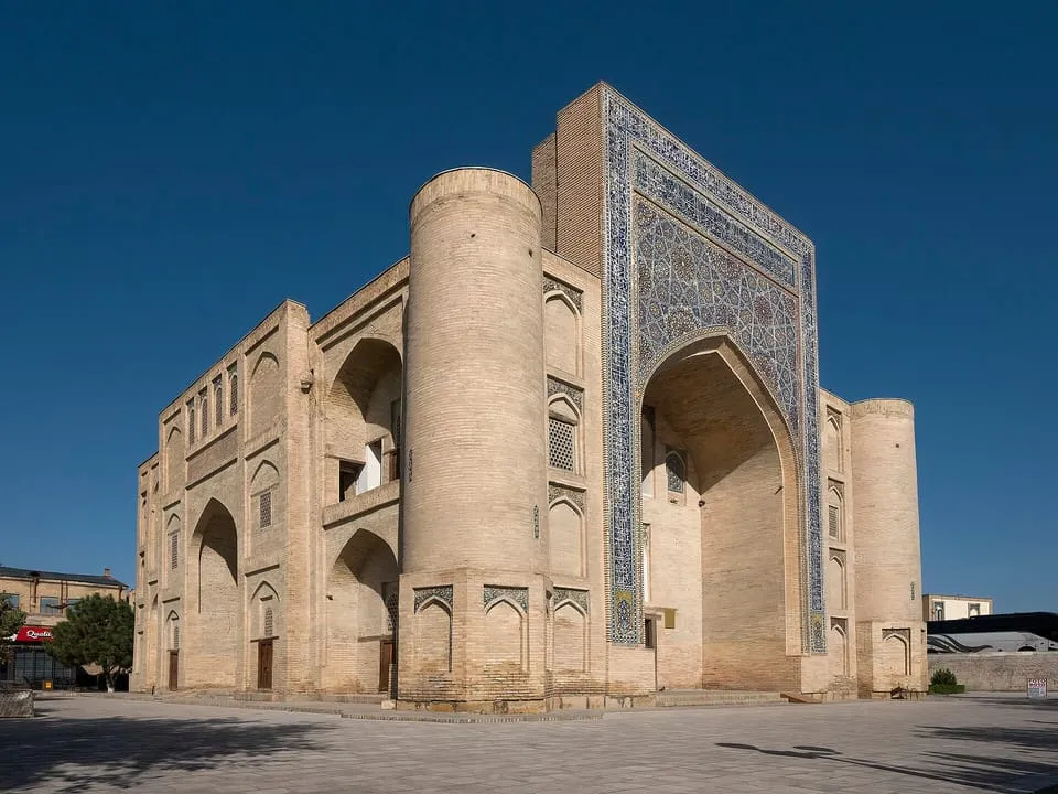 The tiled gateway of the Nodir Devonbegi khanqah under a blue sky