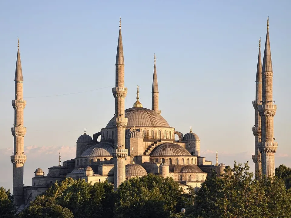 The domes and minarets of the Blue Mosque in evening light