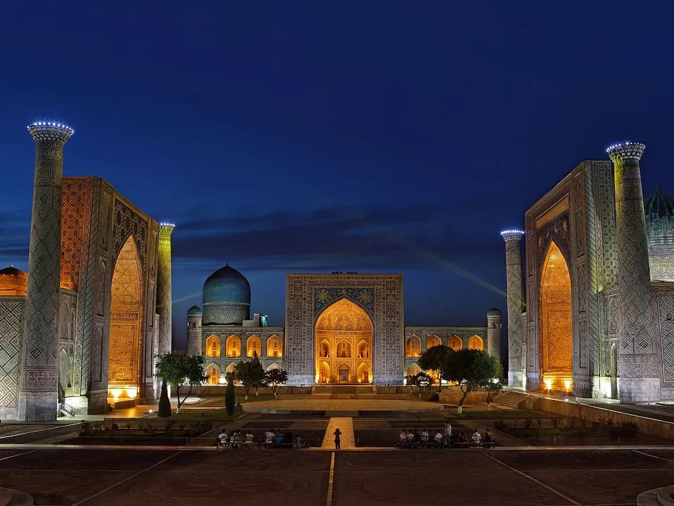 The three madrasas of Registan square lit up at night