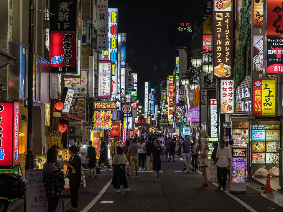 Neon signs above a street in Kabukichō, Shinjuku, at night