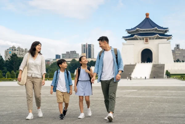 A family crossing the plaza at Chiang Kai-shek Memorial Hall in Taipei